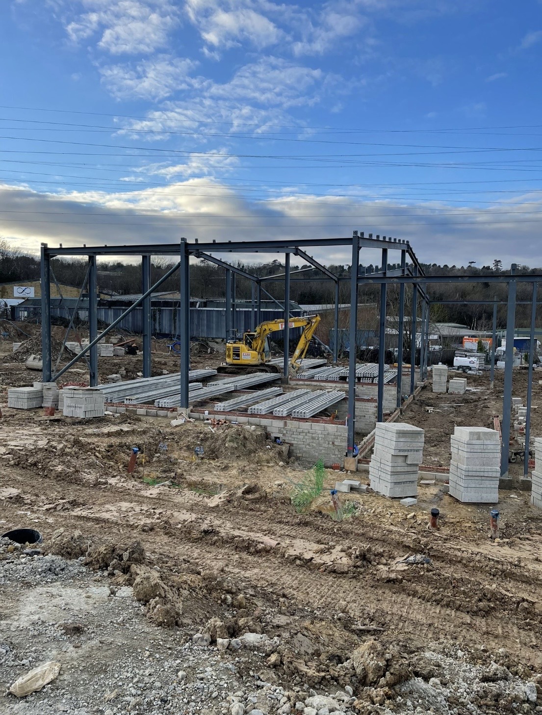 Steel portal frame raised over block walls and beam-and-block flooring